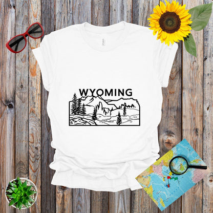 a t - shirt with the words wyoming on it next to a sunflower